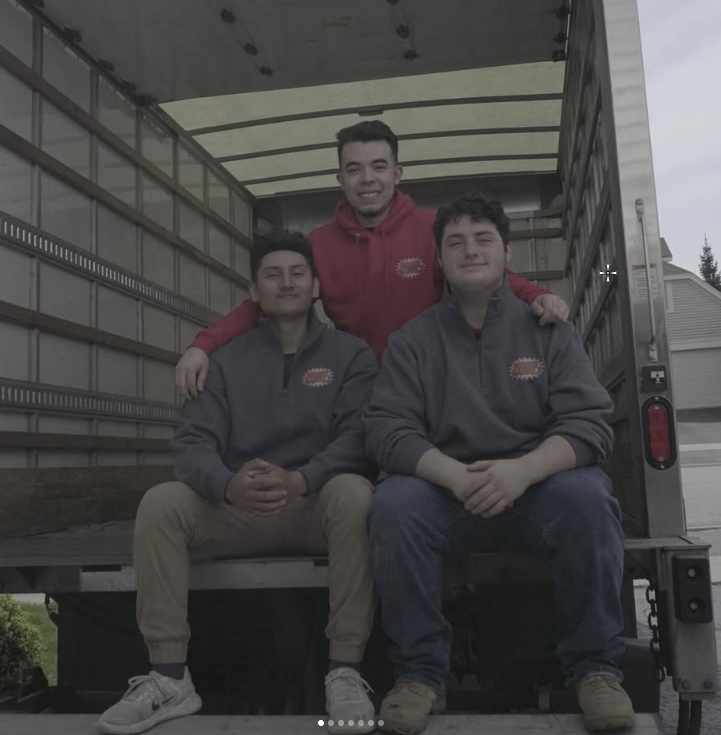 Moving Marvelz junk removal team with service truck in Lake Zurich